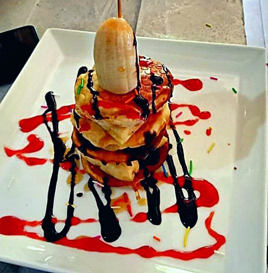 Artfully plated dessert with chocolate and berry
