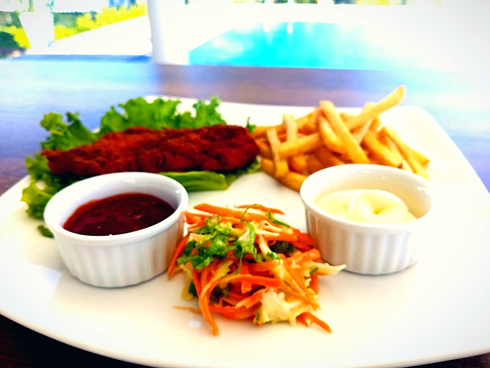 Crispy fried platter with fries, salad and dips