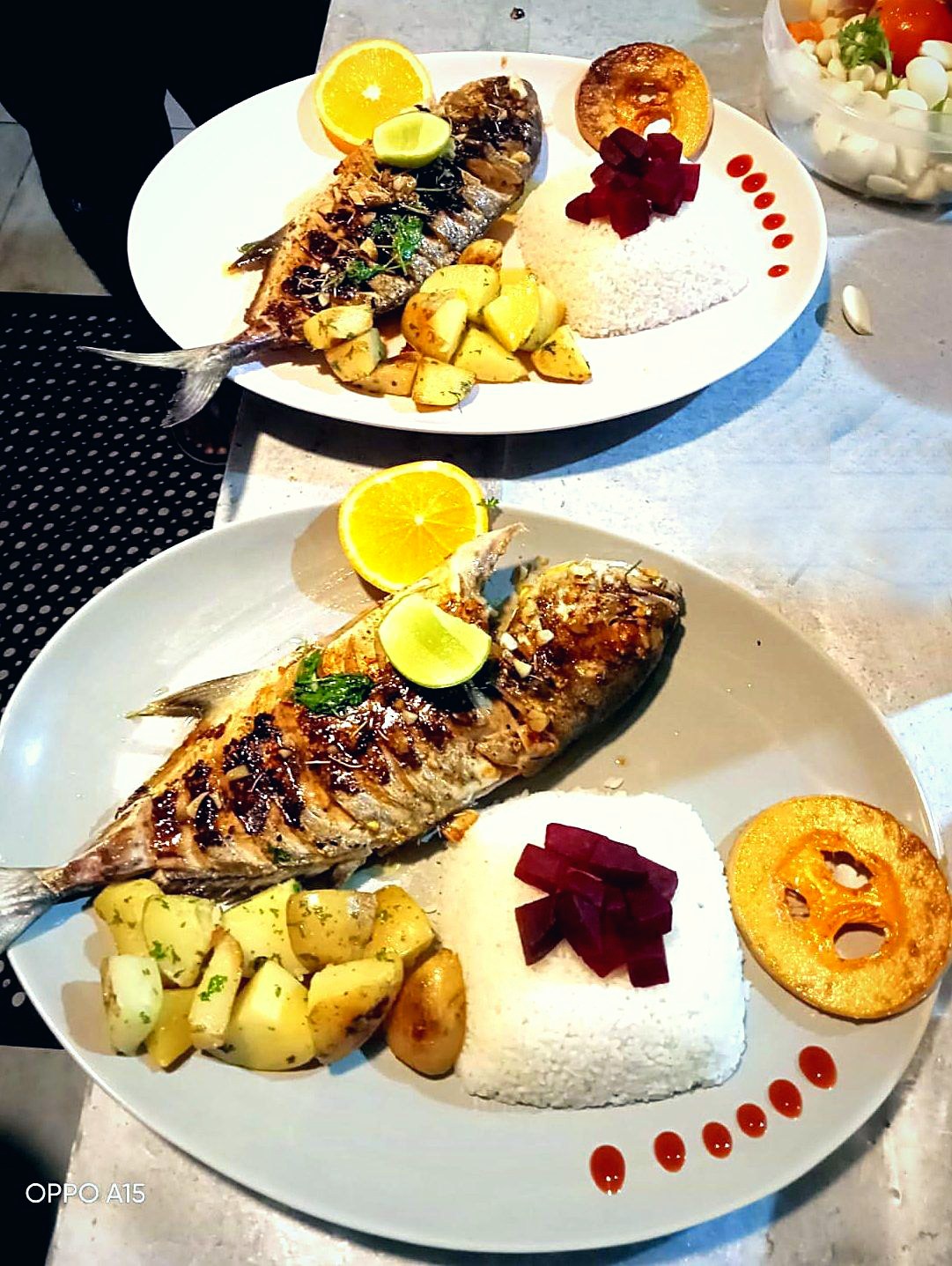 Grilled fish with rice and vegetables