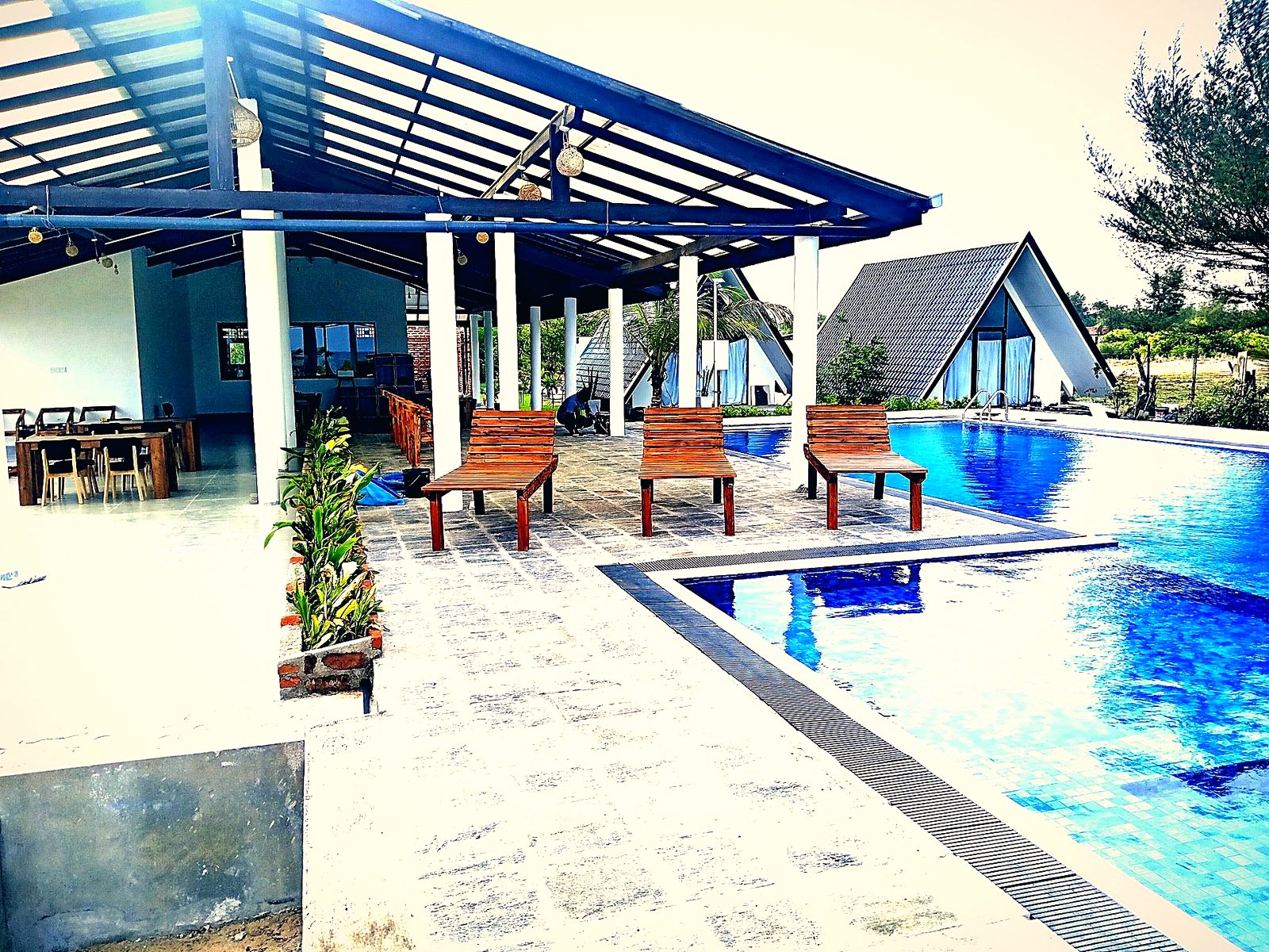 Pini Villa pool and A-frame villas